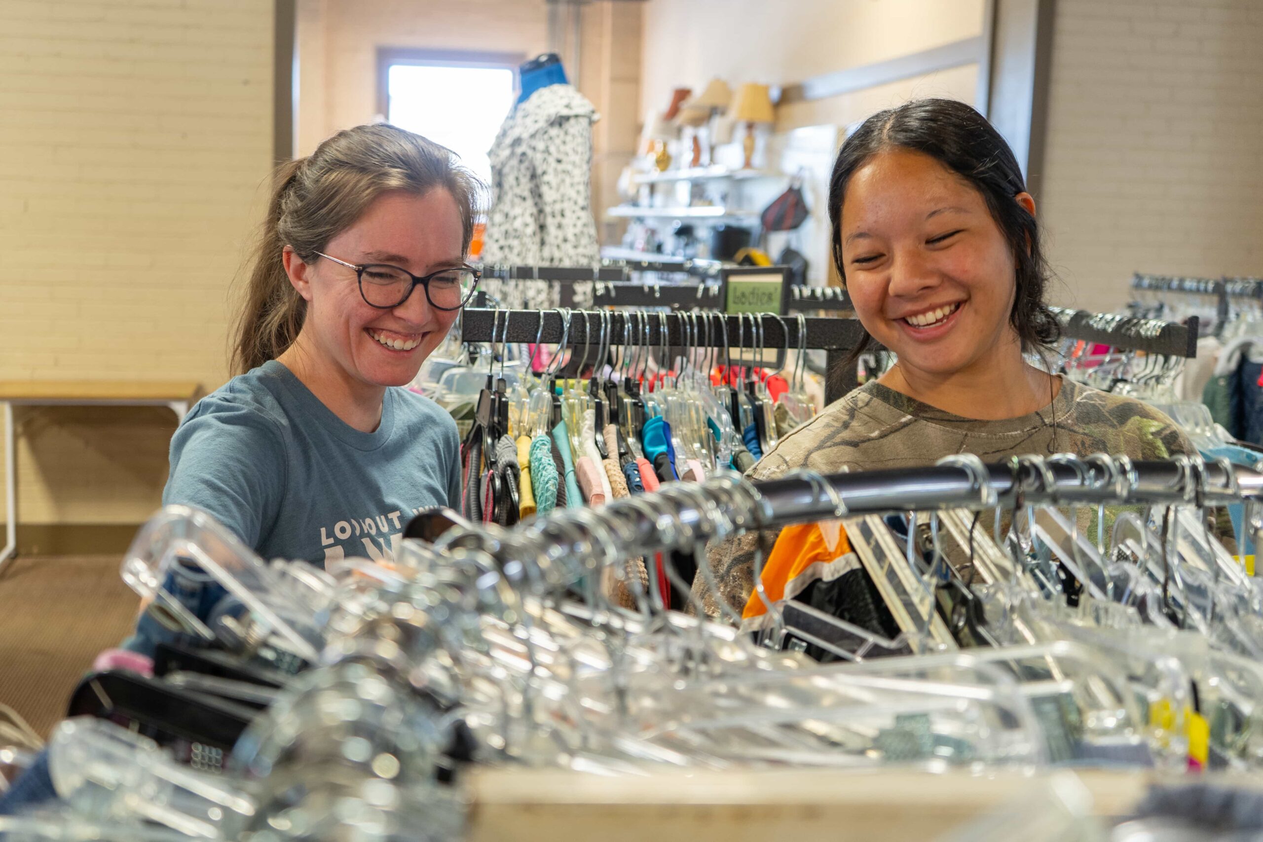 Fair Play Thrift Store team members sorting clothing together