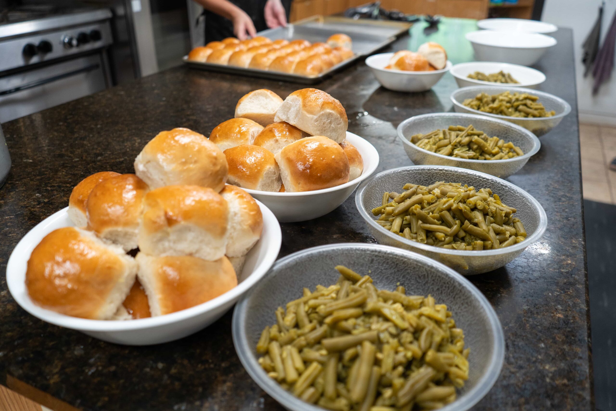 Fresh rolls and vegetables prepared for a Fair Play Camp meal